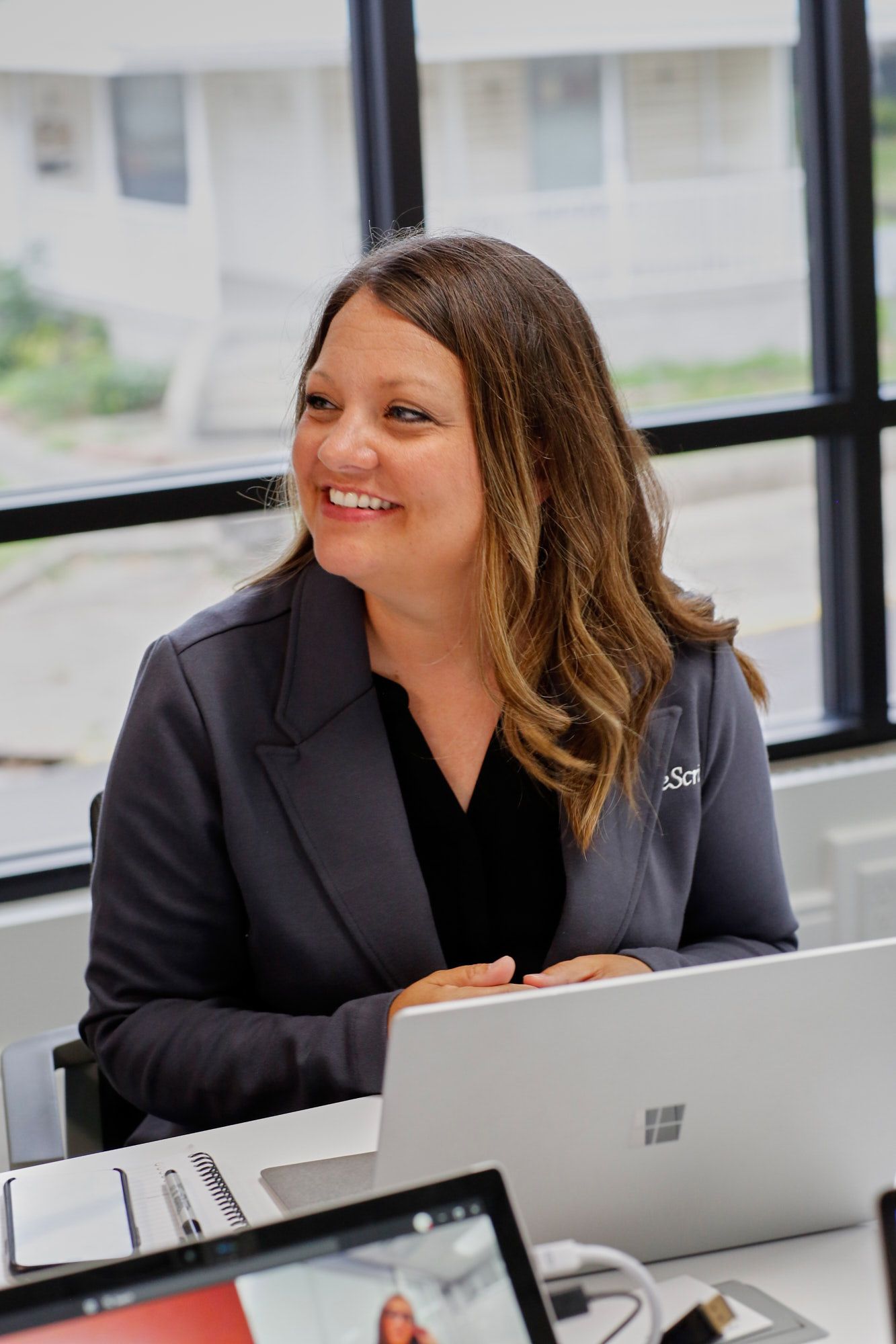 Ashly, TrueScripts employee smiling