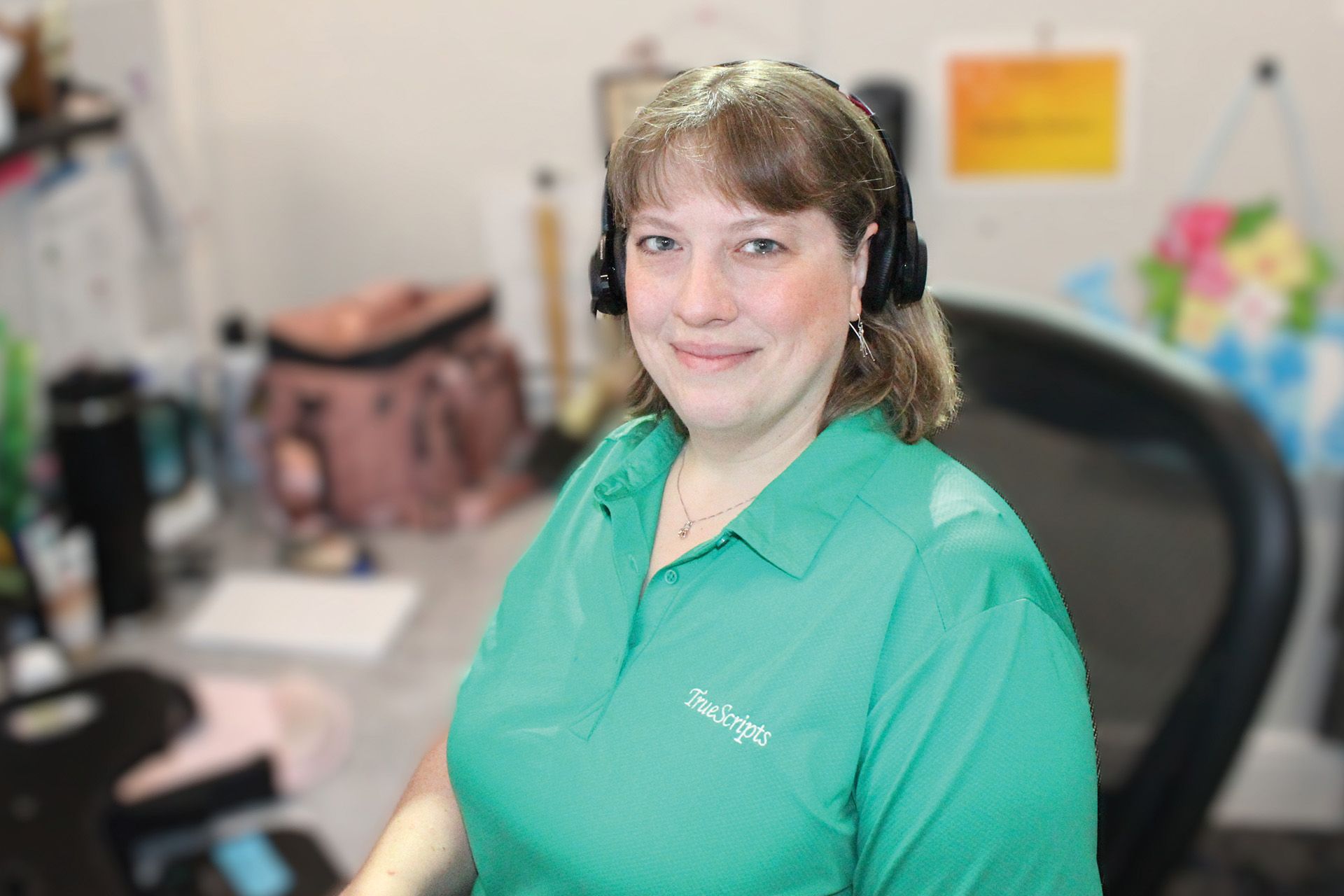 Meredith, TrueScripts Member Care Advocate sitting at her desk