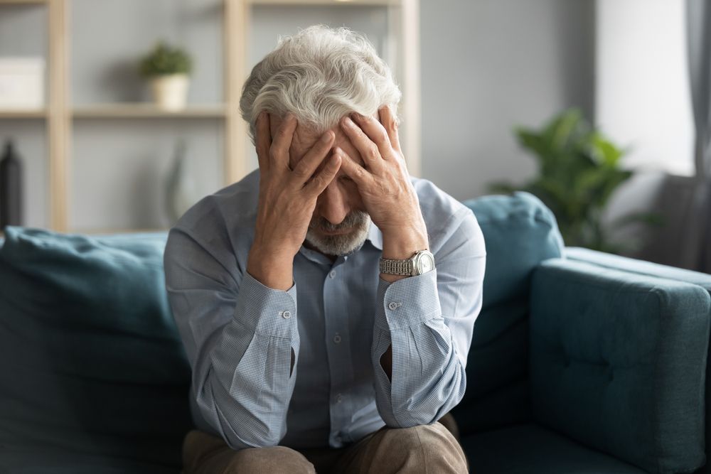 a man experiencing extreme fatigue due to kidney disease