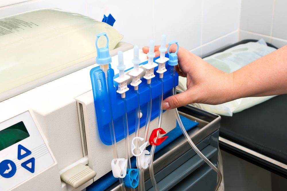 A person is using a machine with tubes attached to it.