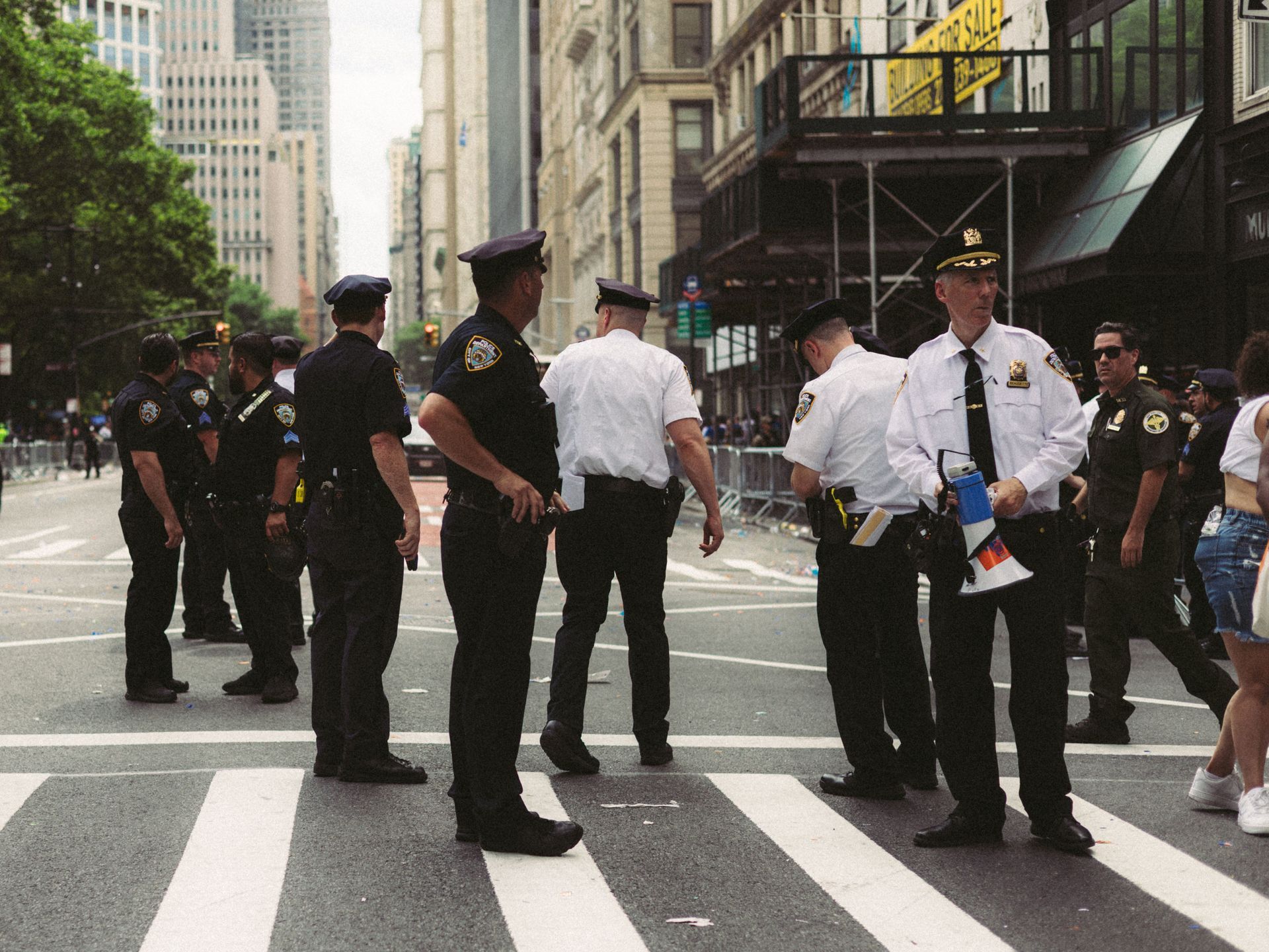 Uniformed security officers on a Manhattan street, representing NYC security guard workers compensation coverage