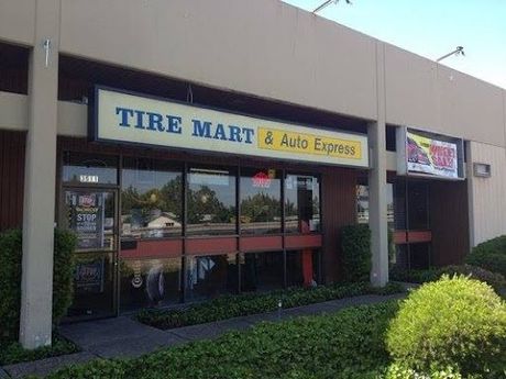 The front of a tire mart and auto express store.