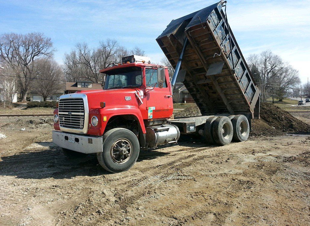 Red Truck — Deerbourne, MO — Carl’s Septic Tank & Excavating Red Truck — Deerbourne, MO — Carl’s Septic Tank & Excavating
