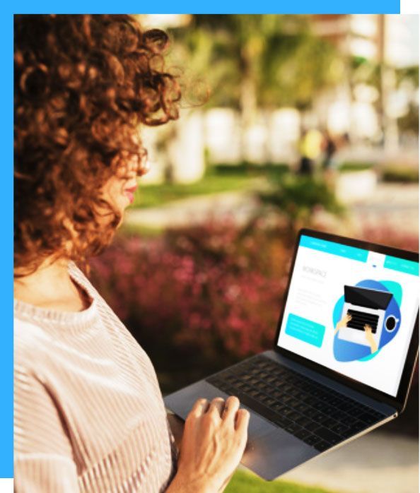 Woman with curly hair using a laptop outdoors, browsing a website with an illustration of a laptop.