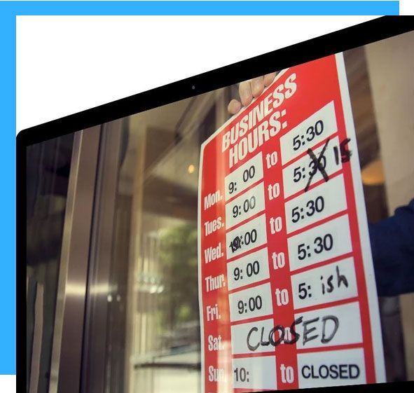 Laptop screen showing a business hours sign being updated; a hand crosses out the 5:30 closing time.