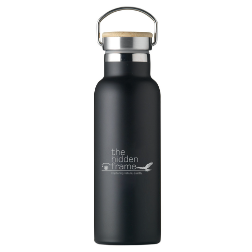 Matte black metal water bottle with a wooden lid, silver handle, and