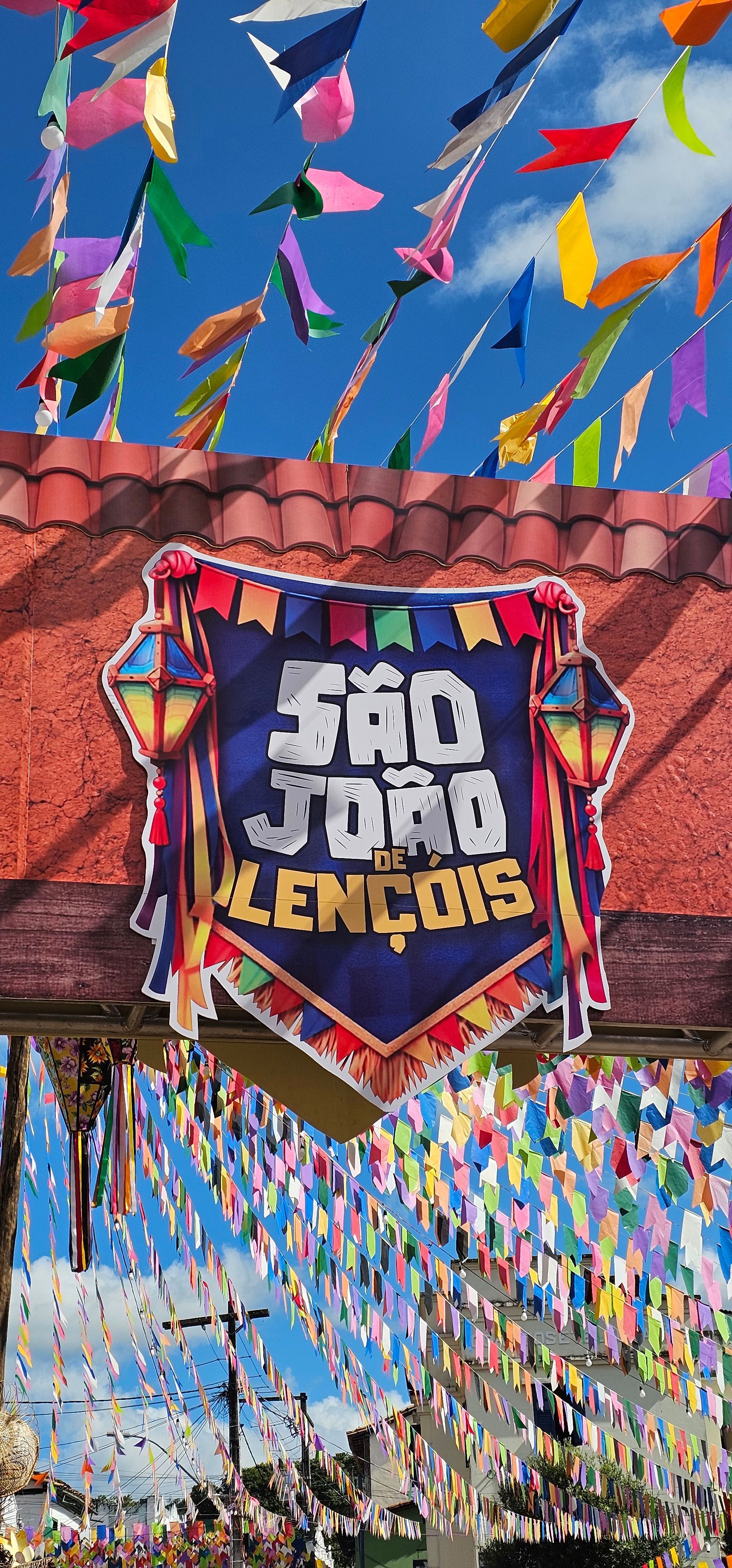 Colorful festive street banners and pennants with a central sign lendo “São João de Londrina”