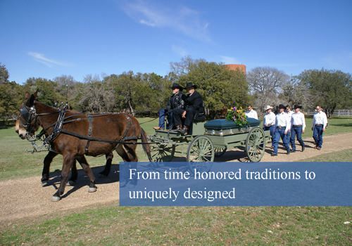 Two horses pull a horse-drawn hearse carrying a casket, with a procession of people walking alongside in a field.