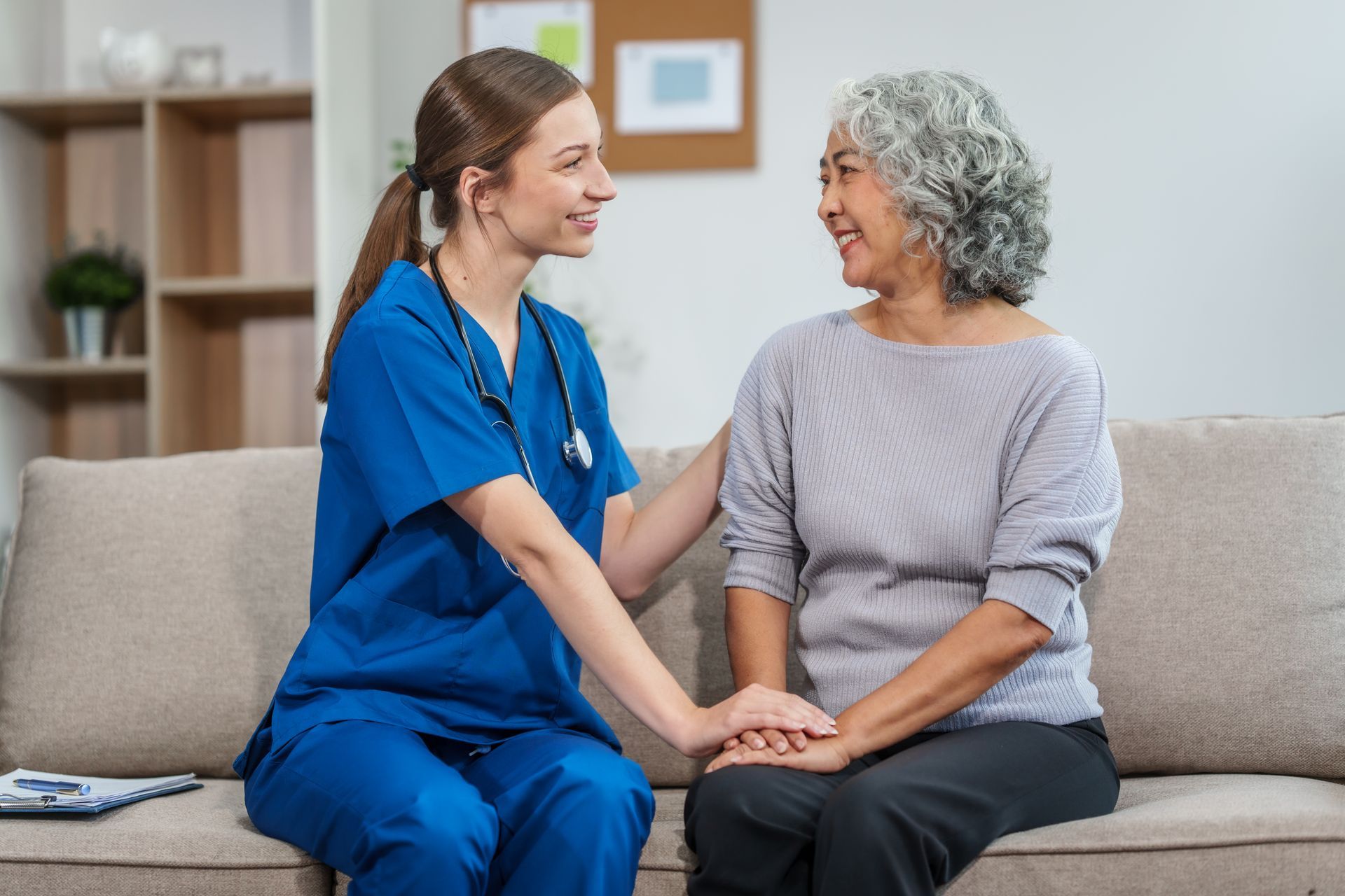 Elderly woman smiling after receiving personal care services at home