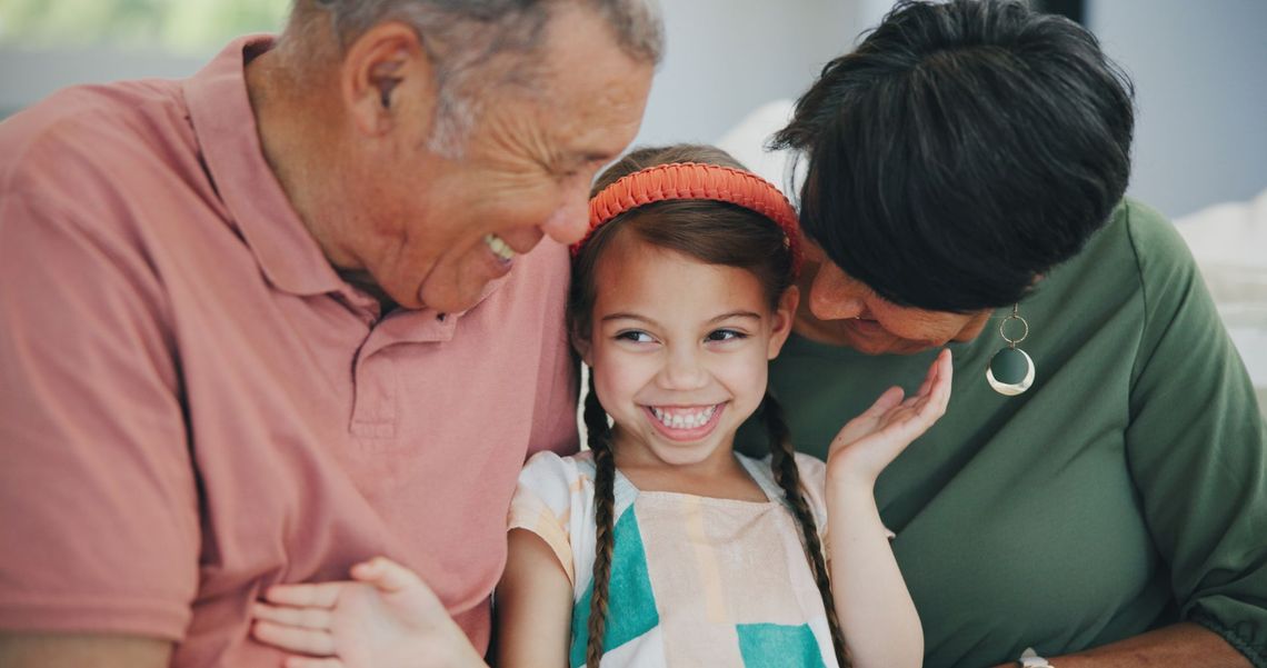 Smiling grandparent sitting with a child after receiving home care services from WillowGrove Homecare