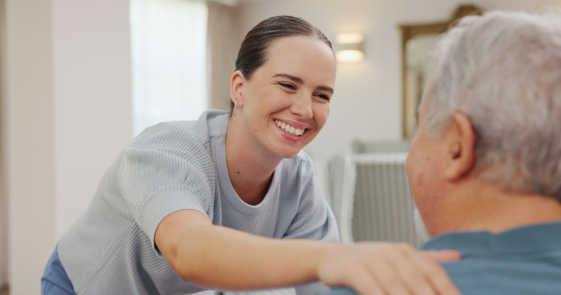 Elderly person receiving personal care assistance at home