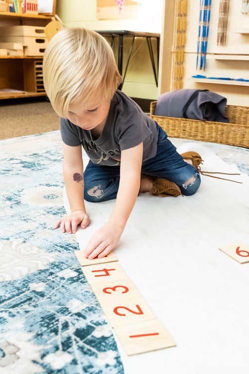 Montessori child working with math materials