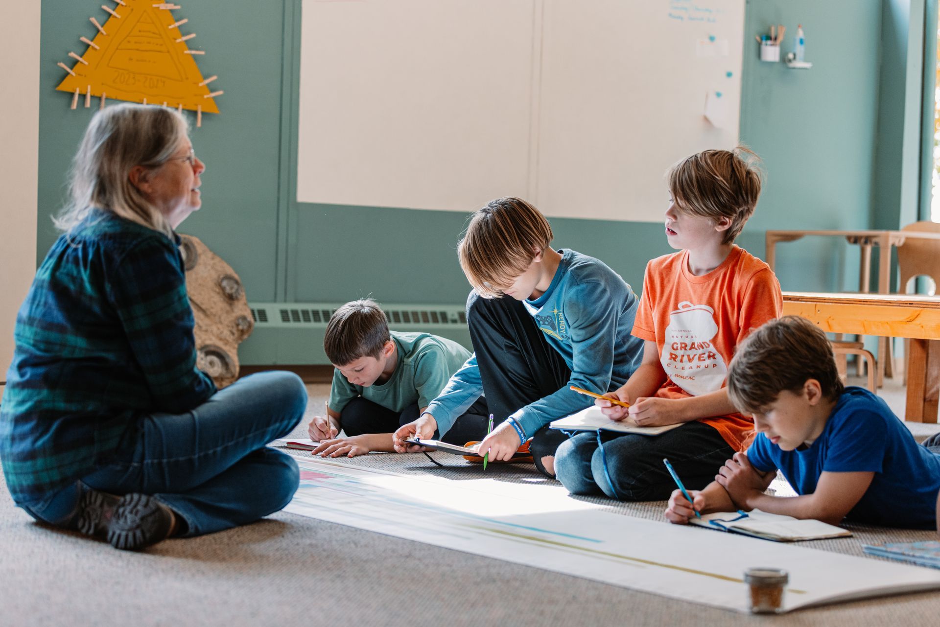 Montessori guide and students during lessons