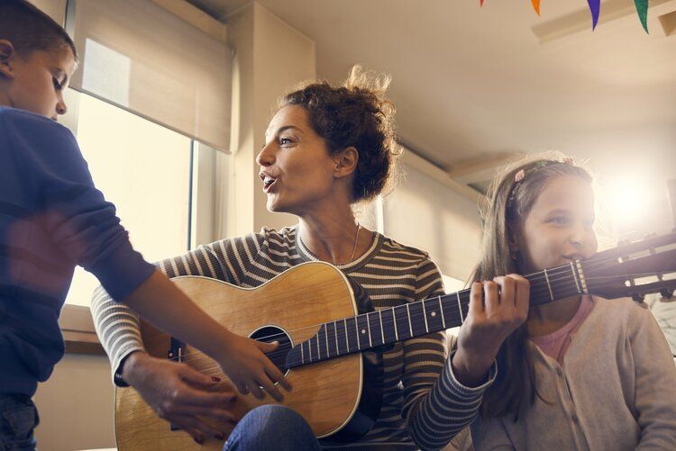 Montessori parent singing with kids