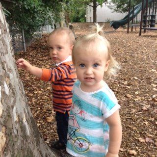 Two Montessori toddlers in playground.