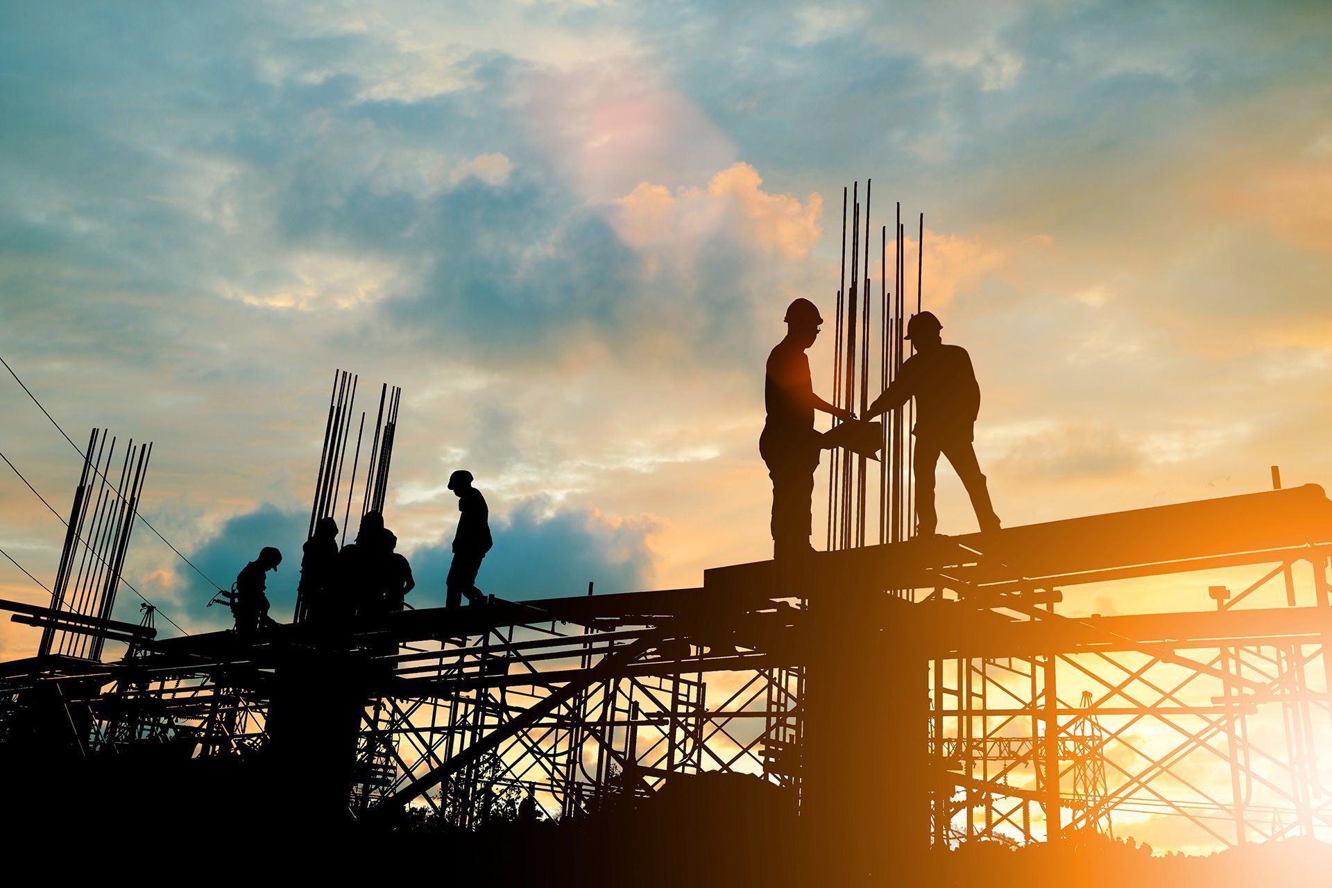engineer and construction team working at site over blurred background sunset pastel for industry background with Light fair