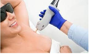 Person receiving laser hair removal treatment on underarm.