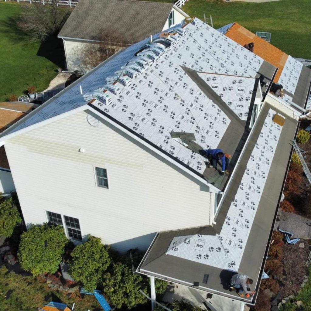 An Aerial View of A House with A Roof Being Installed - New Castle, DE - Macedo Mexpro LLC