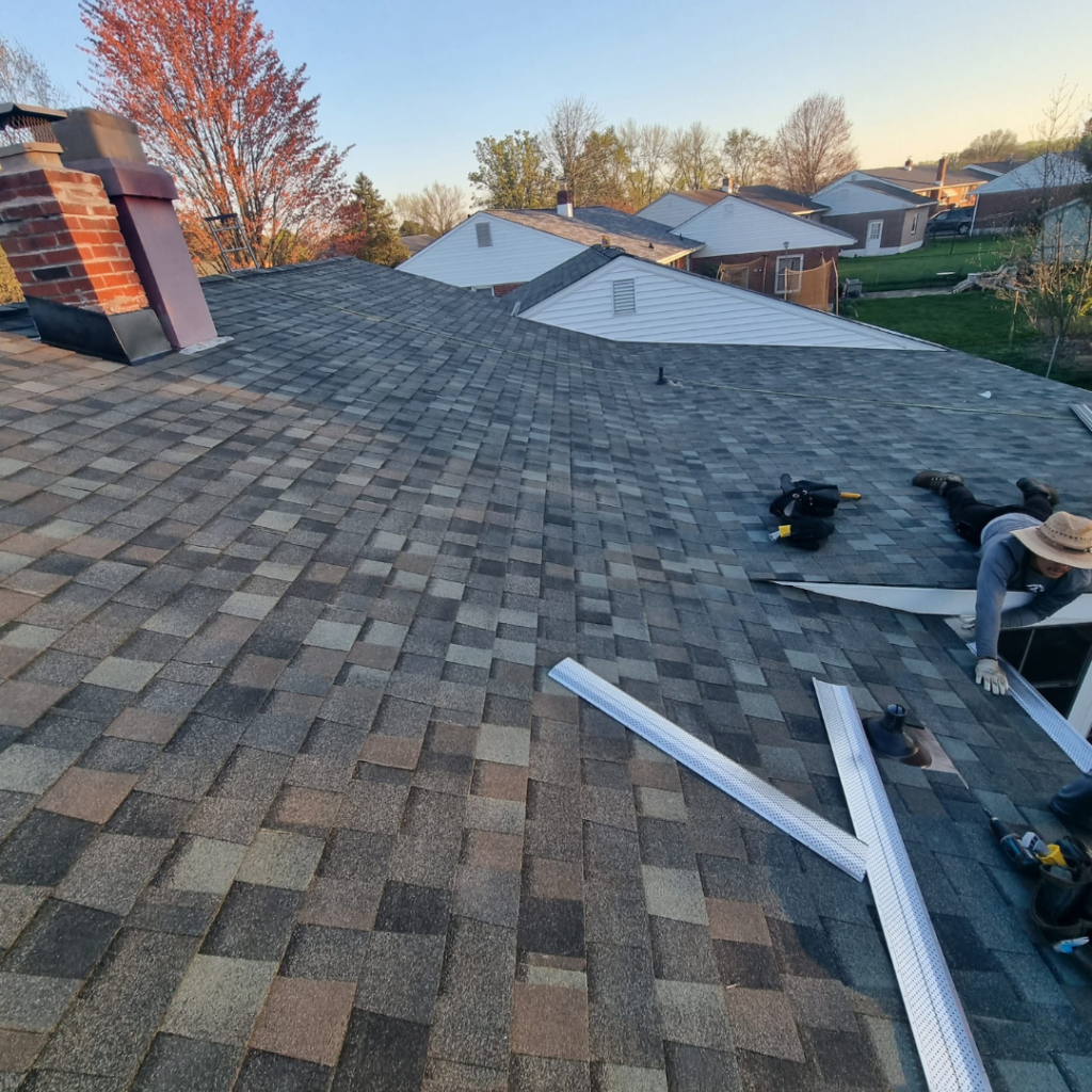 A Man Is Working on The Roof of A House - New Castle, DE - Macedo Mexpro LLC