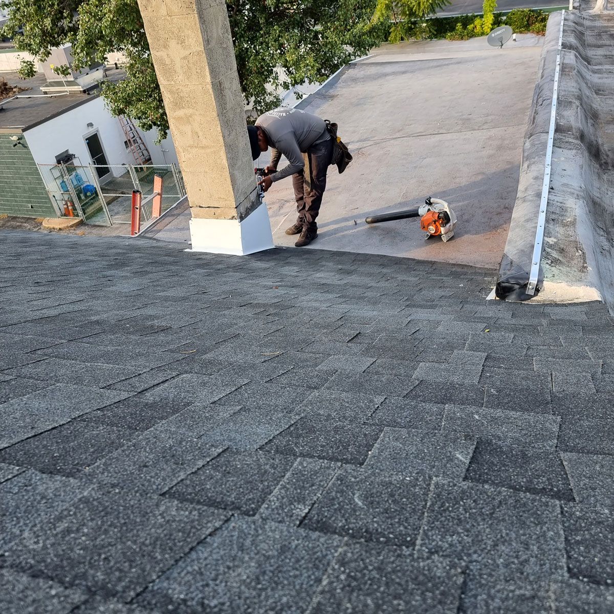 Man Working on the Roof of a Building - New Castle, DE - Macedo Mexpro LLC
