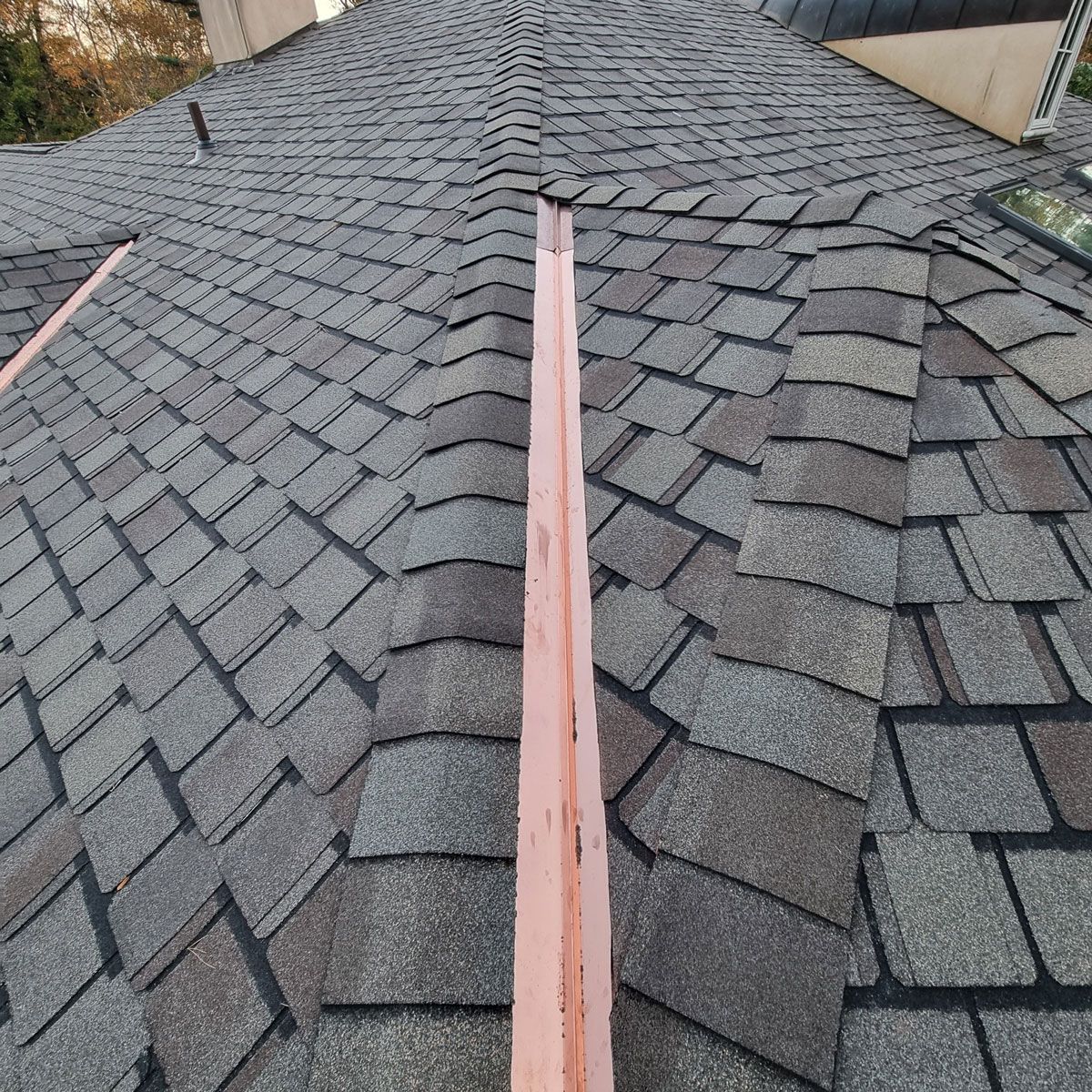 Closeup of a Roof with Shingles and a Copper Gutter - New Castle, DE - Macedo Mexpro LLC