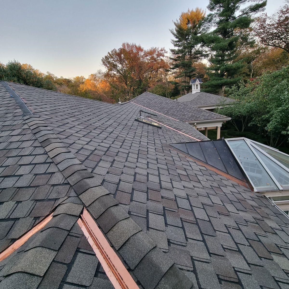 Roof of a House with a Copper Gutter and Shingles - New Castle, DE - Macedo Mexpro LLC