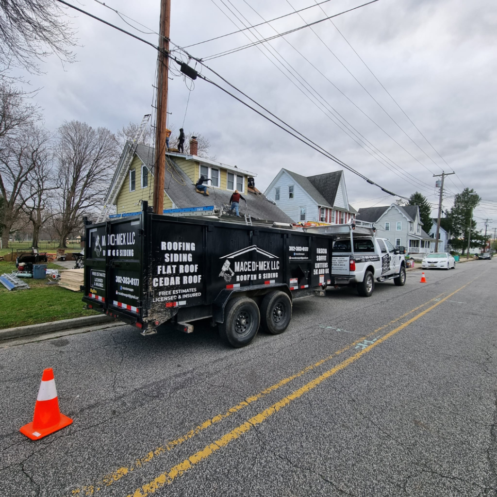 A Truck with A Trailer Attached to It Is Parked on The Side of The Road - New Castle, DE - Macedo Mexpro LLC