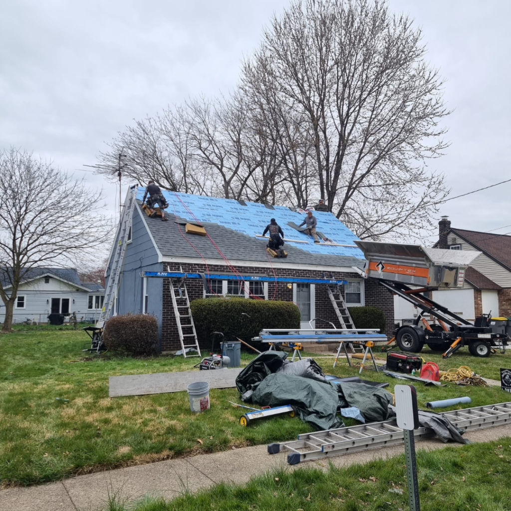 A Group of People Are Working on The Roof of A House - New Castle, DE - Macedo Mexpro LLC