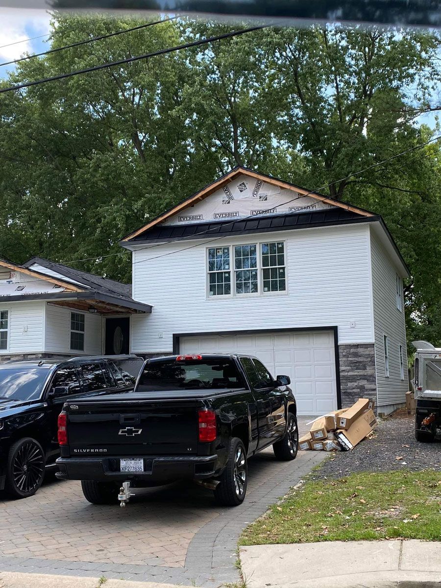 Black Car in Front of a House - New Castle, DE - Macedo Mexpro LLC