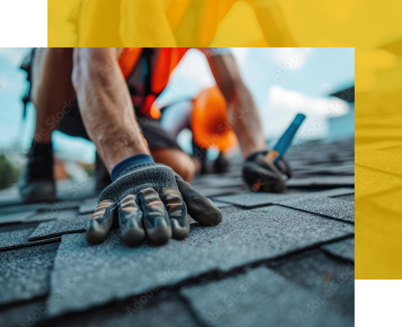 Roofer installing shingles on a roof, wearing gloves and safety gear.