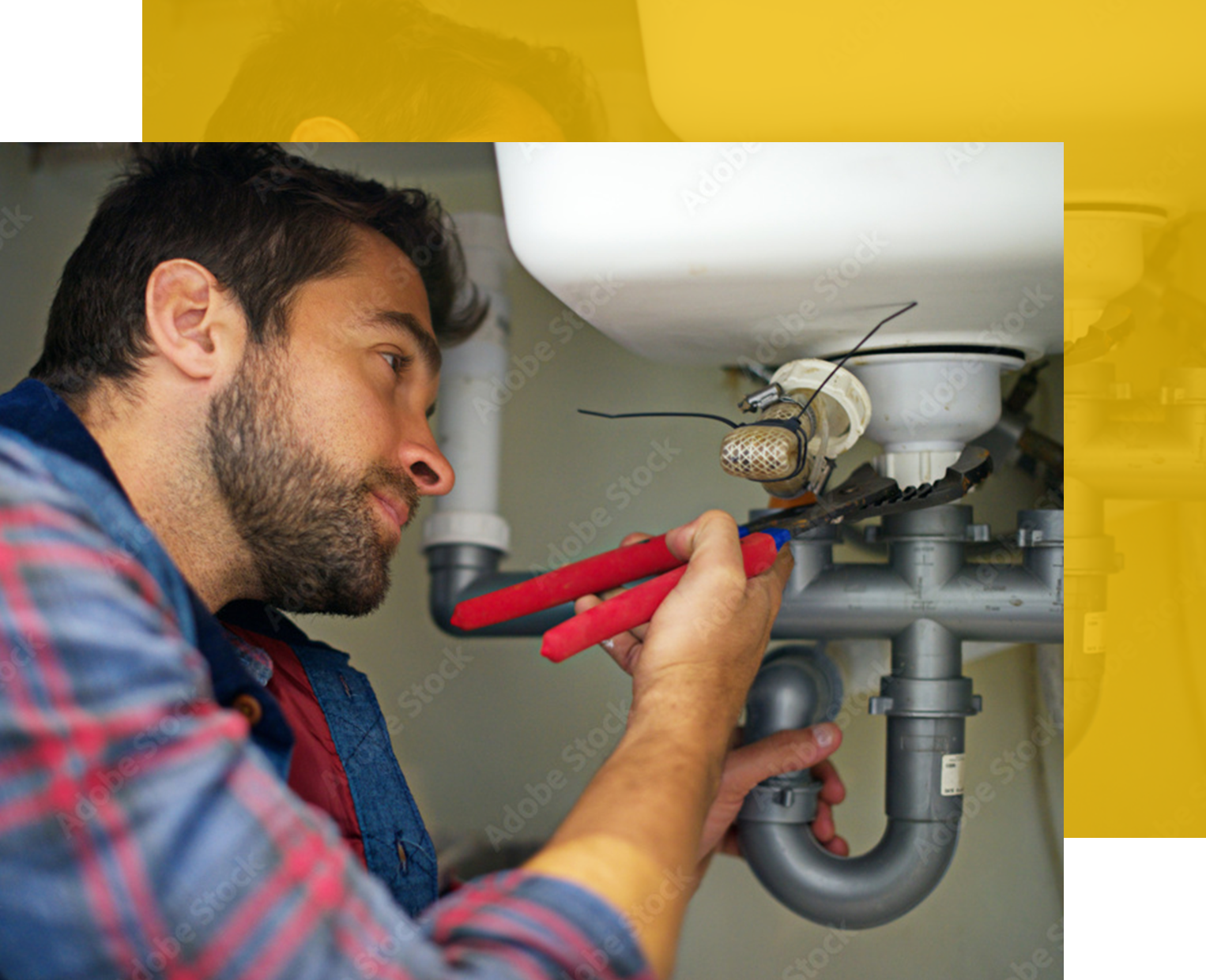 Plumber repairing a sink, using pliers on pipes under a white sink in a home setting.