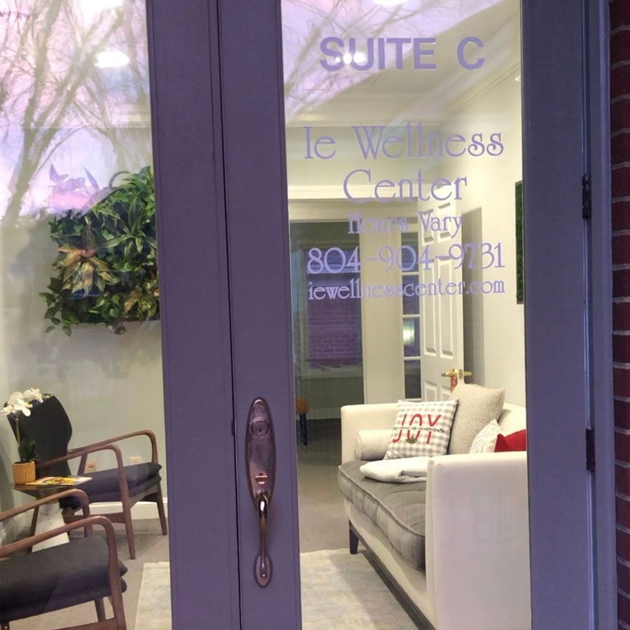 A purple door that says suite c on it