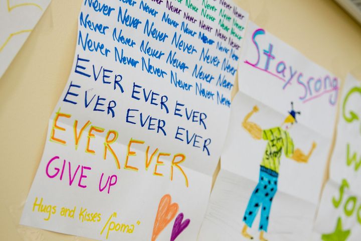 A drawing of a man with the words ever ever ever give up written on it