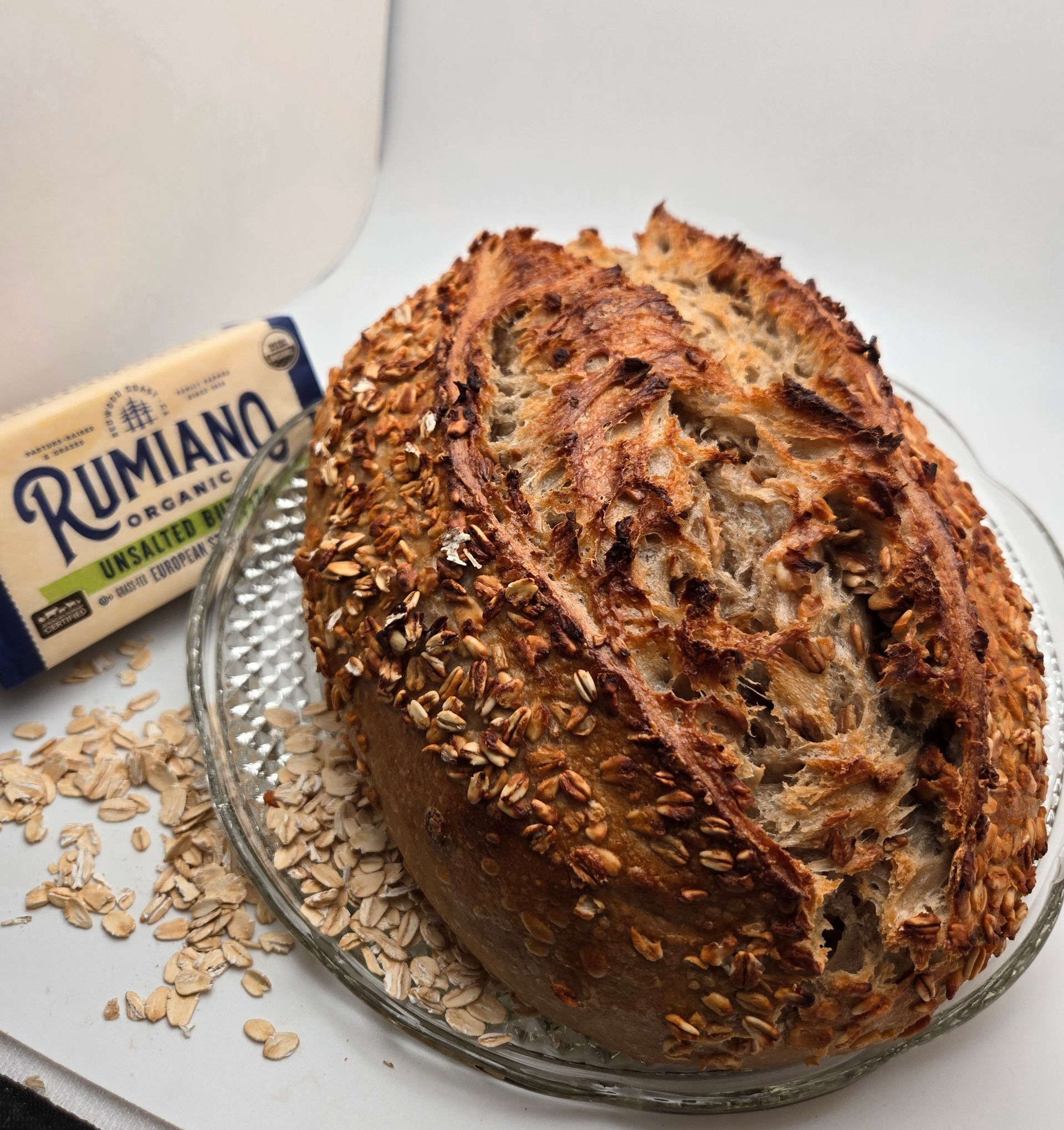 Two braided loaves of golden-brown bread cooling on a wire rack