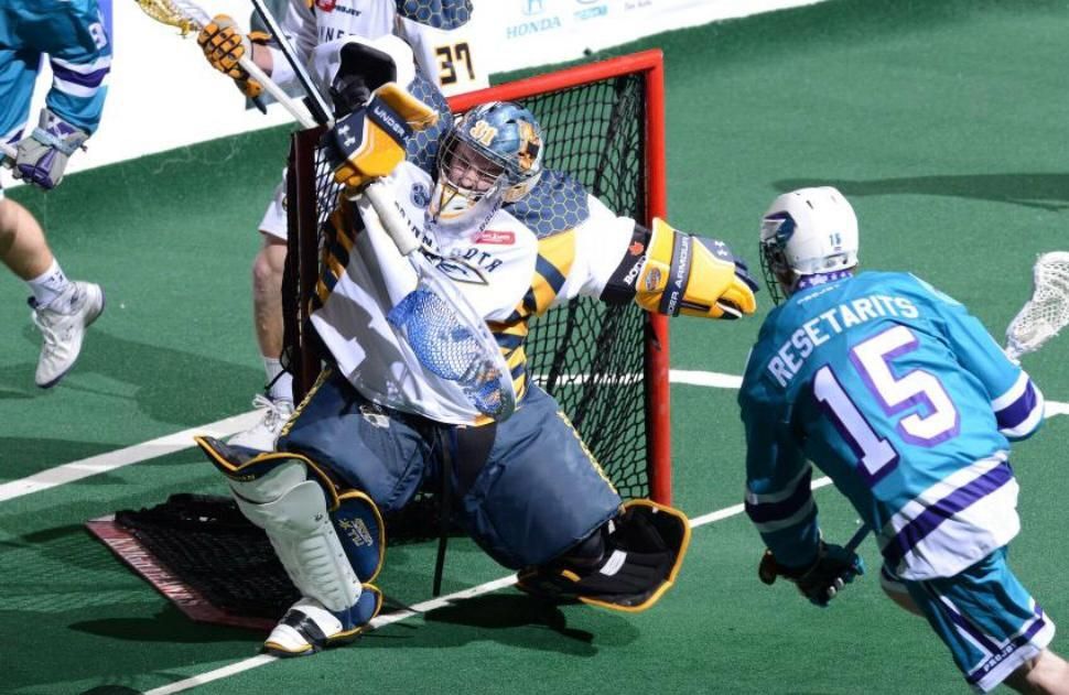 A lacrosse player with the number 6 on his jersey