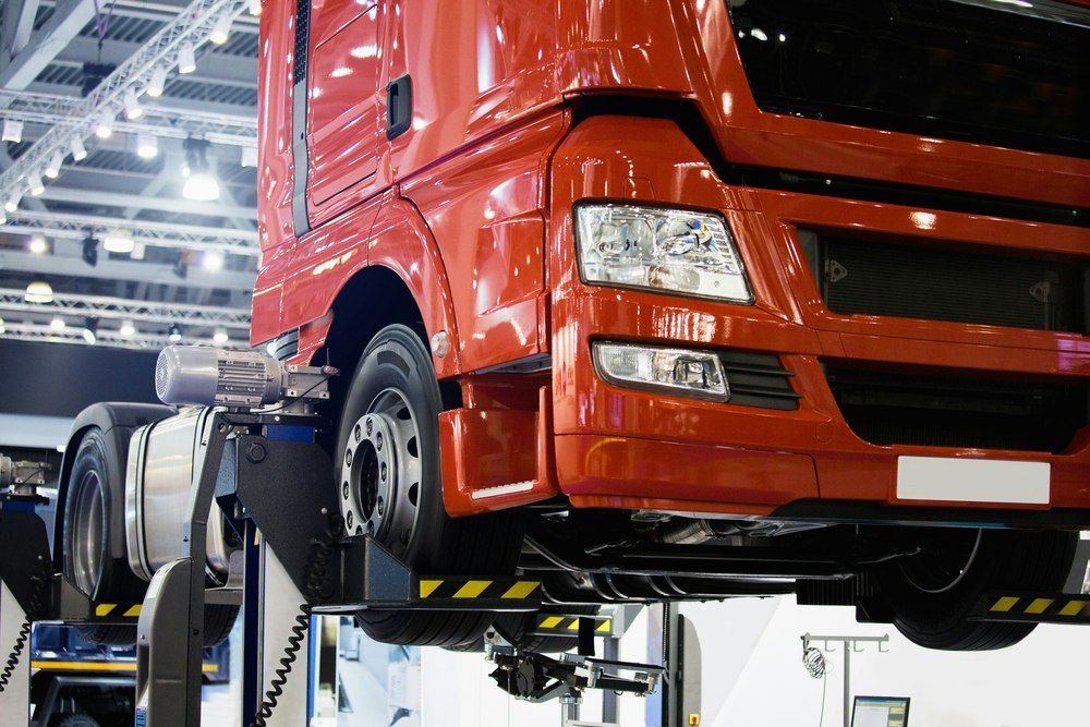Commercial fleet vehicle receiving heavy diesel maintenance