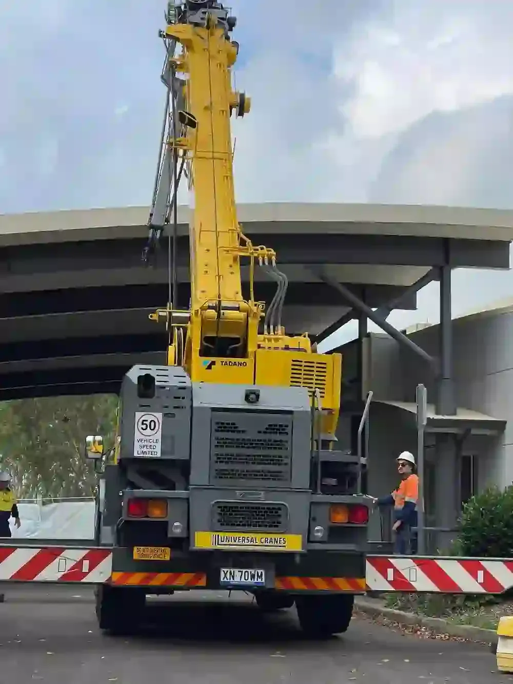 Yellow Crane Is Sitting On The Back Of A Truck — Frigid-Air PTY Ltd In South Lismore, NSW