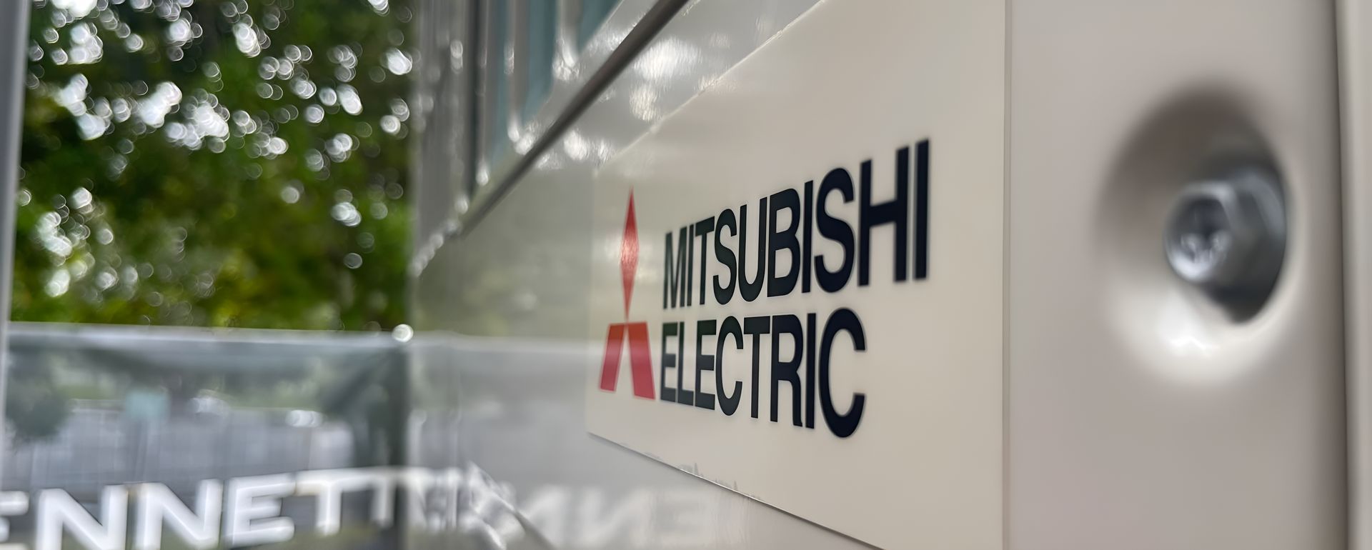 A Mitsubishi Electric Sign Is On The Side Of A Building — Frigid-Air PTY Ltd In South Lismore, NSW