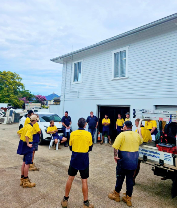 Two Men Are Working On A Machine In A Warehouse — Frigid-Air PTY Ltd In Bangalow, NSW