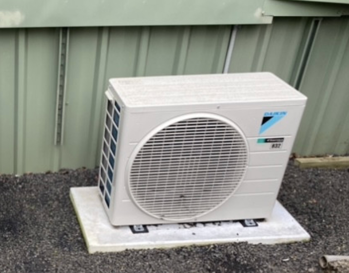 An Air Conditioning Unit Sitting Out Side With Dakin Labelled On the Right - Frigid-Air PTY Ltd In South Lismore, NSW