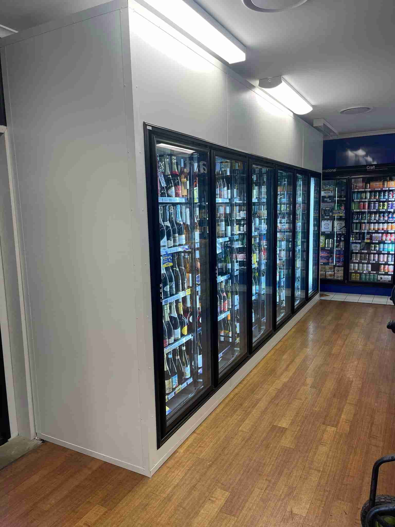 A Row Of Refrigerators Filled With Lots Of Beer In A Store — Frigid-Air PTY Ltd In Ballina, NSW