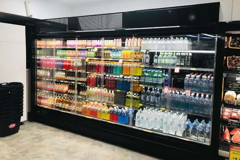 A Refrigerator Filled With Lots Of Drinks In A Store — Frigid-Air PTY Ltd In Bangalow, NSW