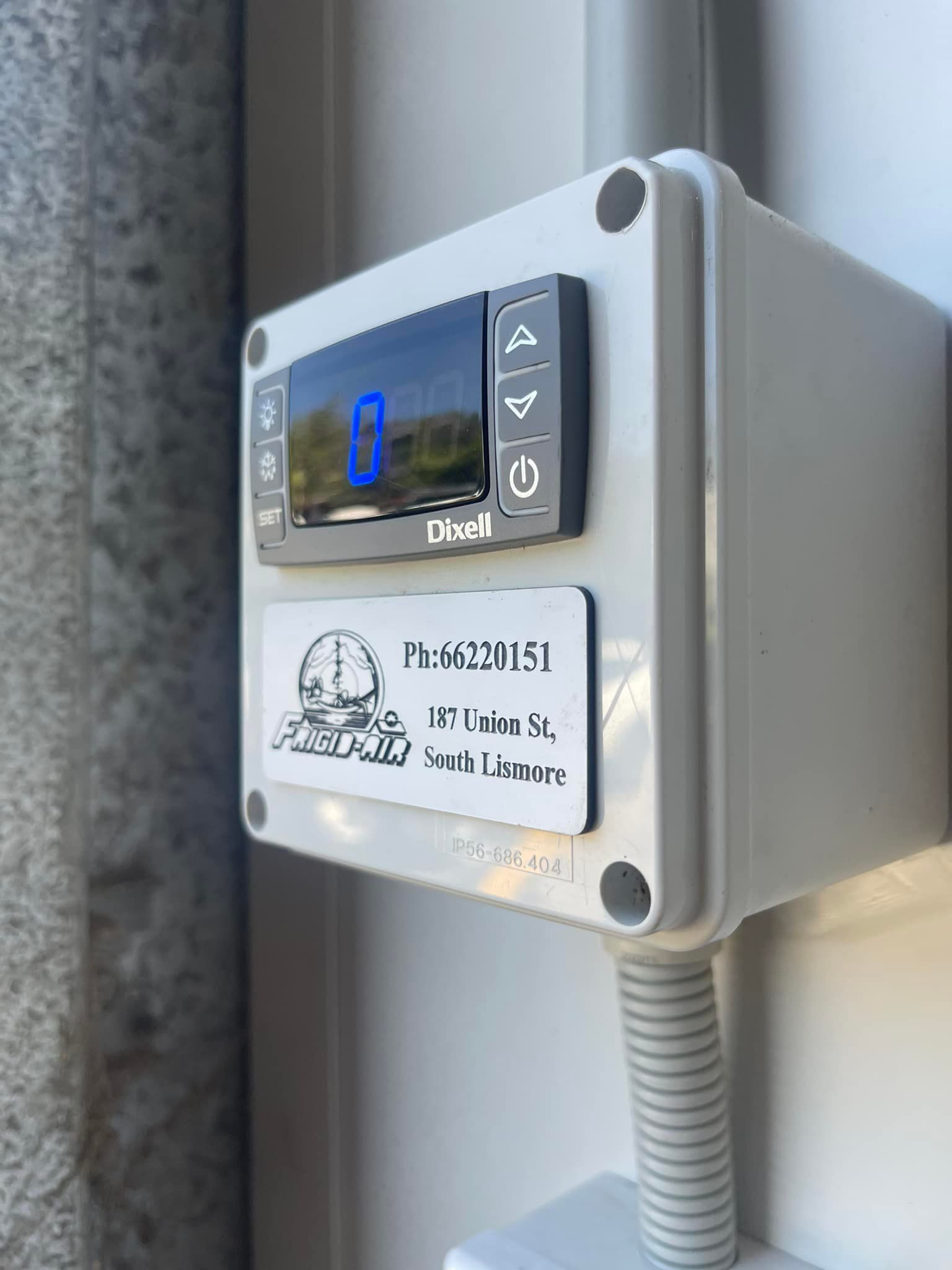 A White Box With A Clock On It Is Attached To A Wall — Frigid-Air PTY Ltd In Bangalow, NSW