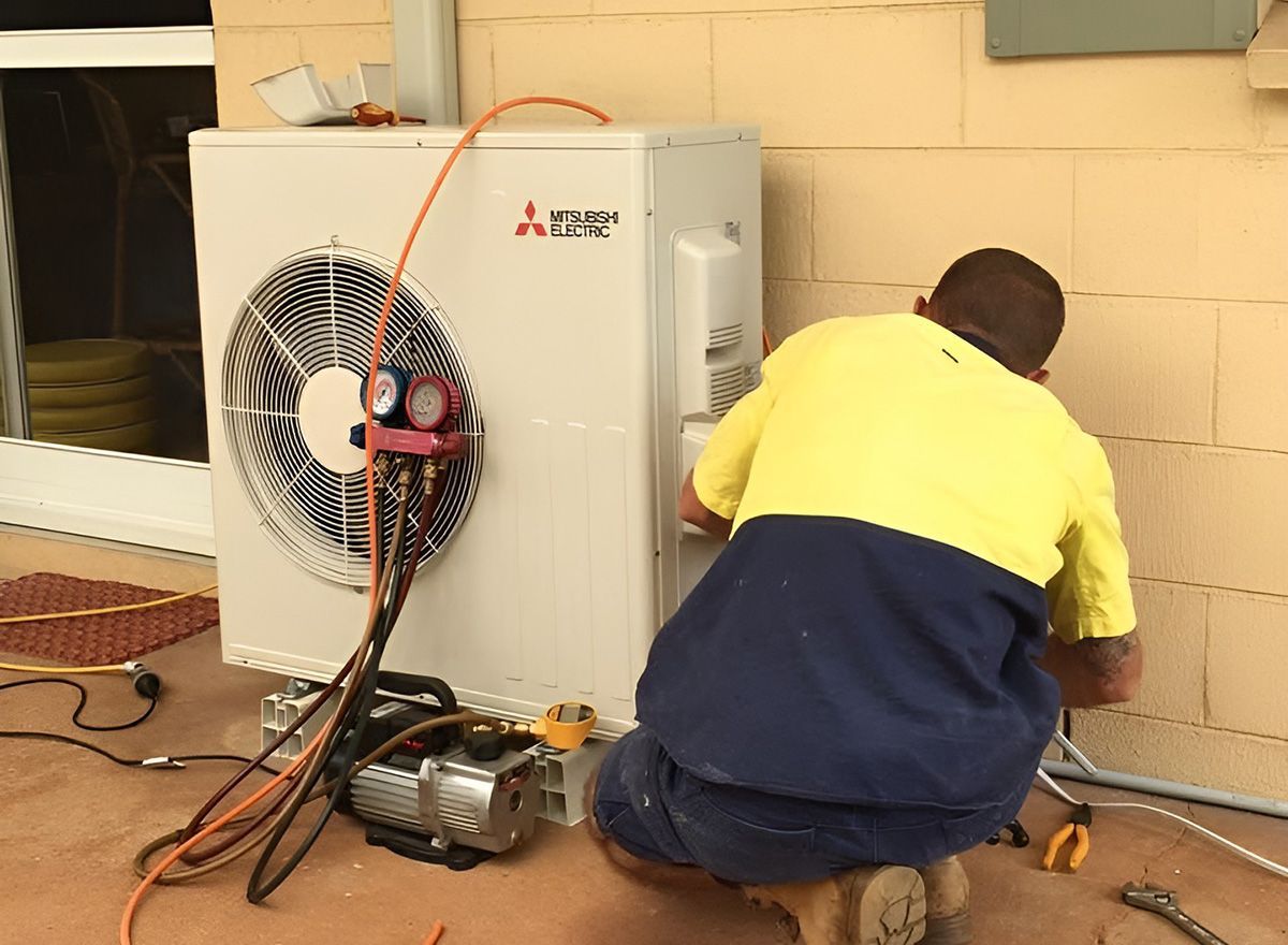 Reverse Cycle Air Conditioner Being Serviced For Winter Heating Issues