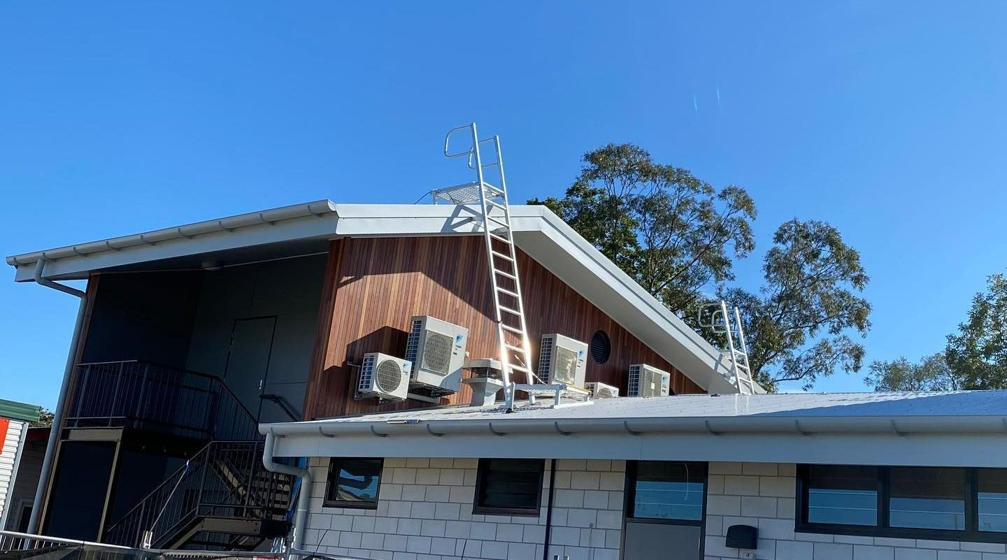 There Is A Ladder On The Roof Of A House — Frigid-Air PTY Ltd In Lismore, NSW
