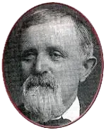 A black and white photo of a man with a beard in a circle.
