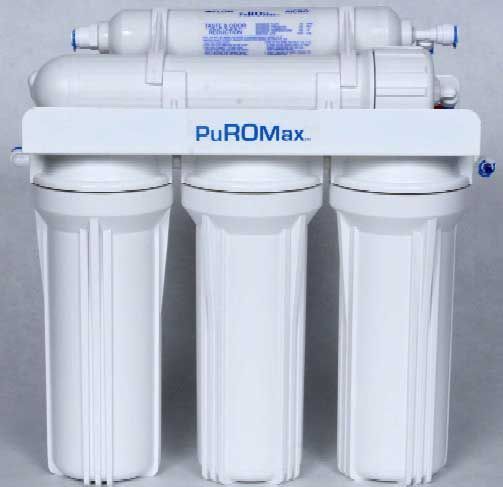 White PuROMax water filtration system with three canisters and a horizontal filter cartridge on top