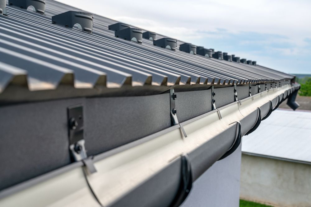 Gray Metal Roof With Matching Gutters and Downspouts — Callaway Roofing & Construction in Cowra, NSW