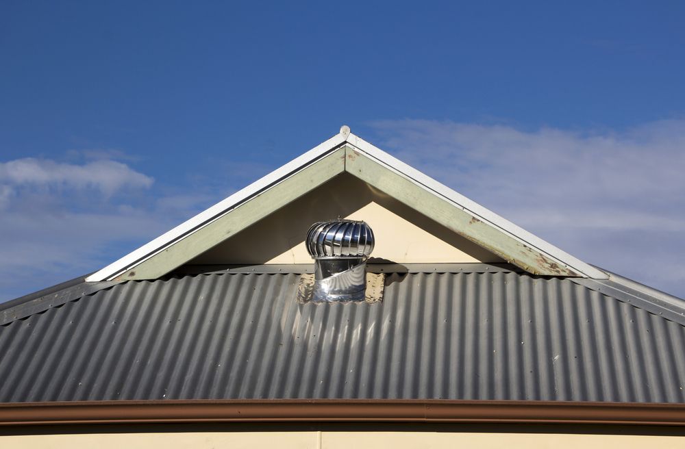 Metallic Roof With a Rotating Wind Turbine Vent — Callaway Roofing & Construction in Dubbo, NSW