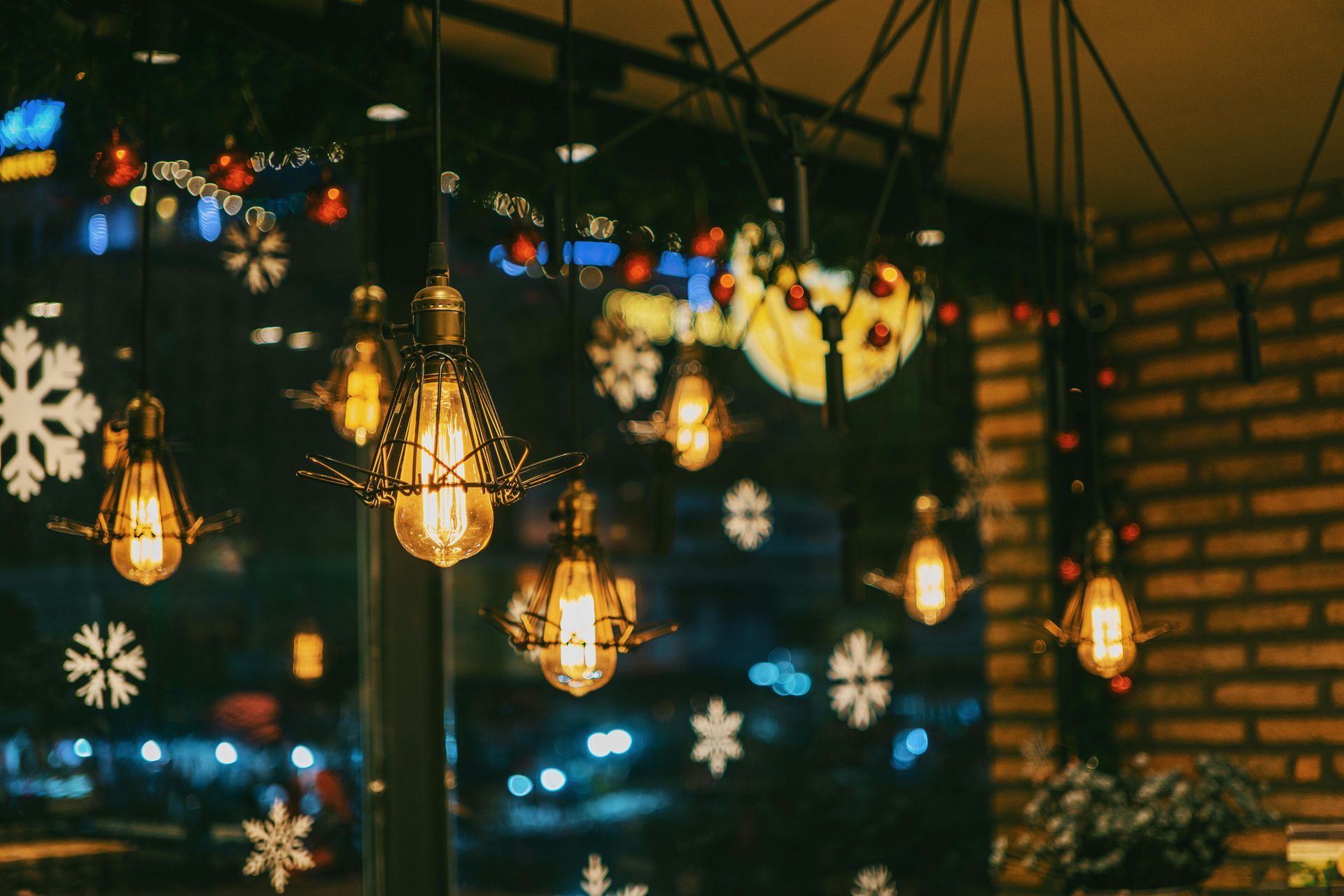 A bunch of lights are hanging from the ceiling in a room.
